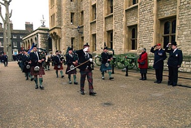 A picture of the Scottish Guards saluting the officials